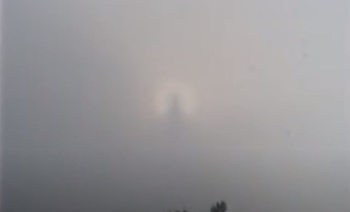 Video. Nimbus with a silhouette of a man in the clouds. An unusual phenomenon in the atmosphere. Madeira Island